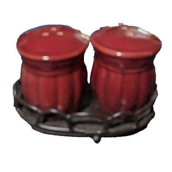 Cranberry colored salt and pepper shakers in metal holding rack - Picture 2 of 3